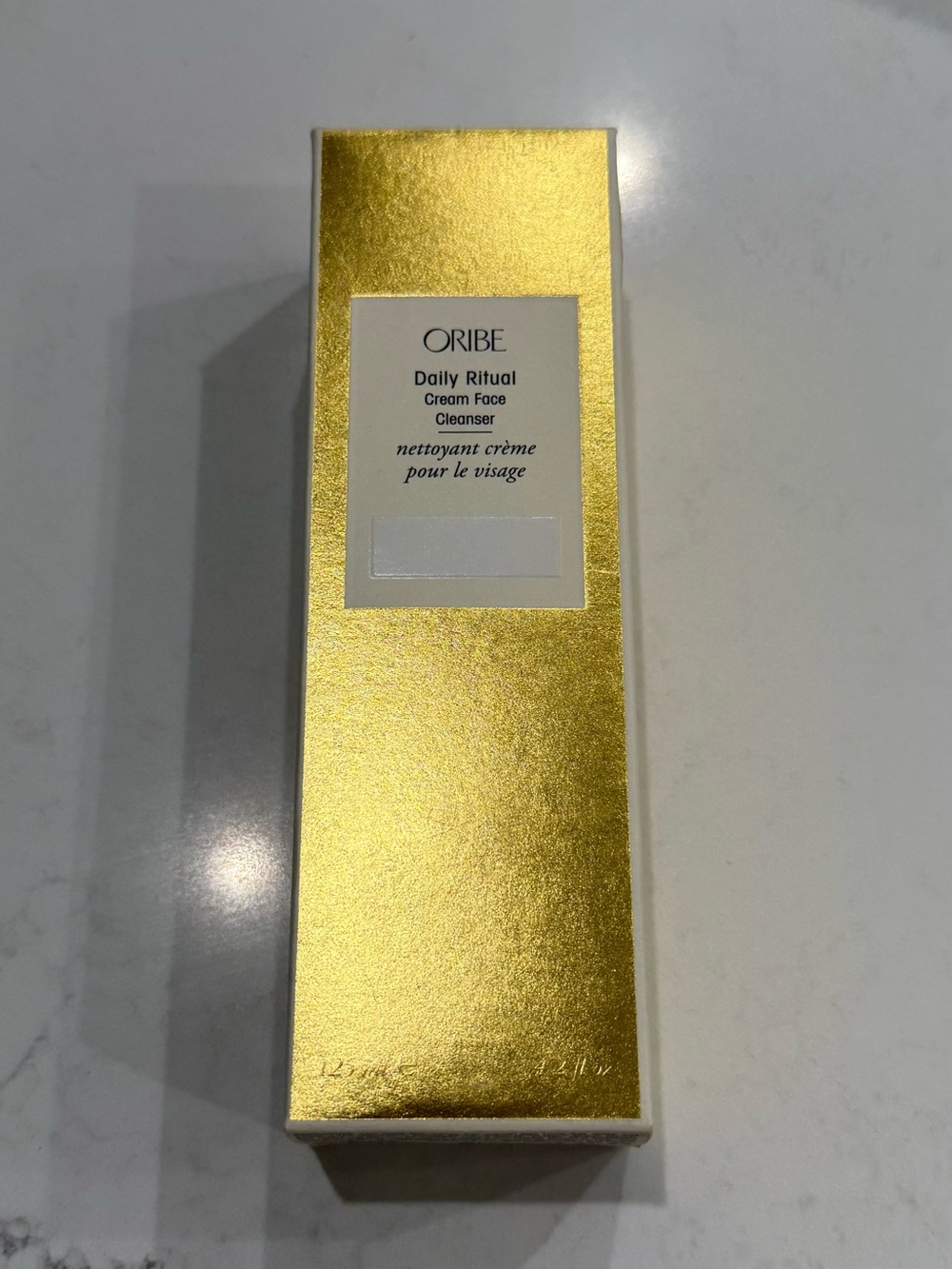 Oribe Face Cleanser Primer in Metallic Gold Packaging
